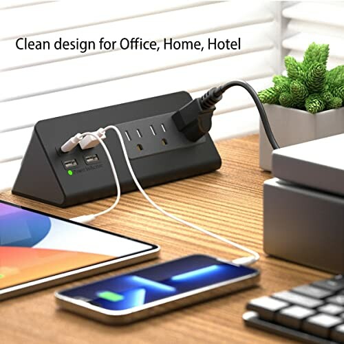 Compact charging station with multiple outlets and USB ports on a desk