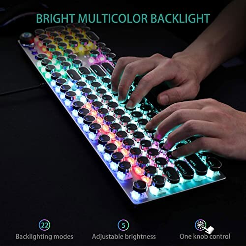 Hands typing on a brightly backlit multicolor mechanical keyboard.