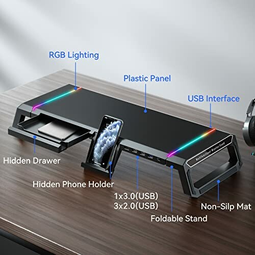 Monitor stand with RGB lighting, USB ports, hidden drawer, and phone holder.